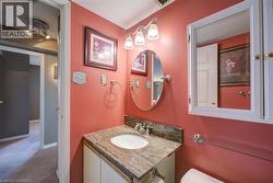 Bathroom featuring vanity and carpet flooring - 