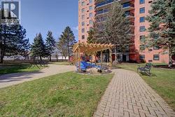 View of property's community featuring a pergola and a patio area - 