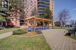View of community featuring a pergola and a patio - 