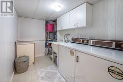 Separate Basement Laundry Room - 