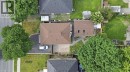 Pitched roof design, skylights, established trees, paved driveway, concrete hardscaping - 627 Upper Sherman Avenue, Hamilton, ON 