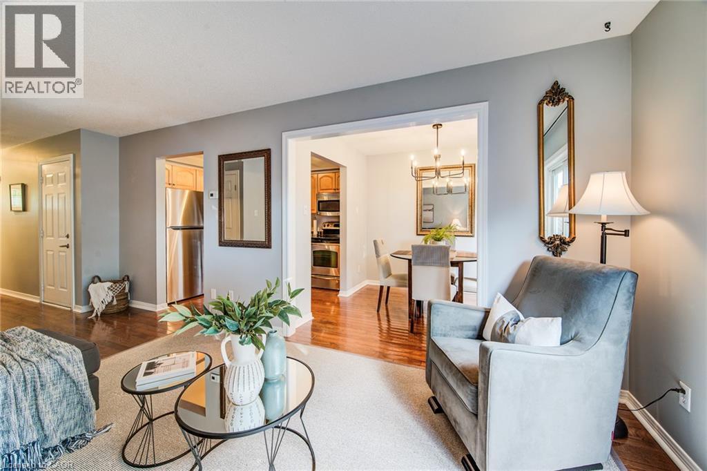 Hardwood-style flooring, stainless steel appliances, recessed lighting, and a chandelier in the dining area - 360 Cornridge Place Unit# 2, Waterloo, ON