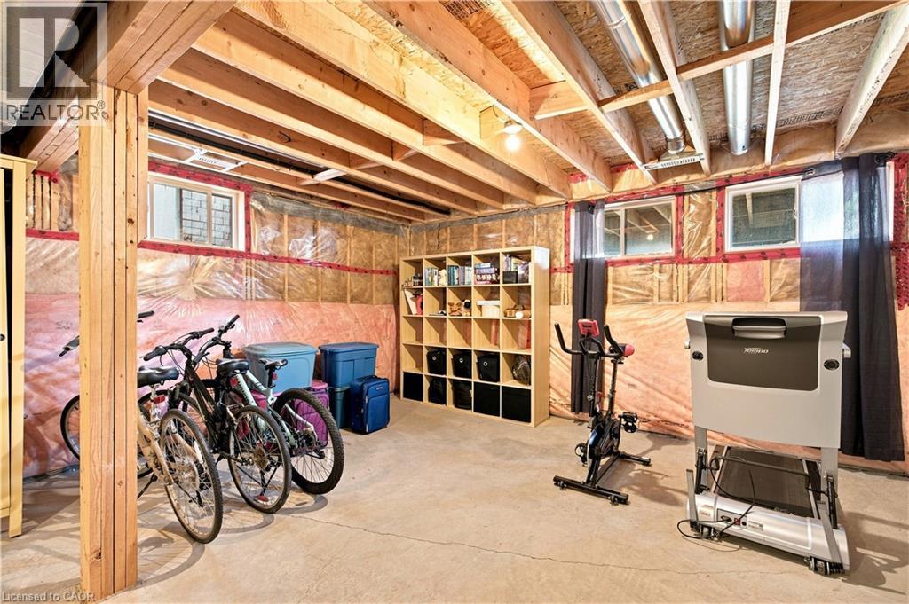 Unfinished lower level featuring exposed wood joists and concrete flooring - 187 Eden Oak Trail, Kitchener, ON
