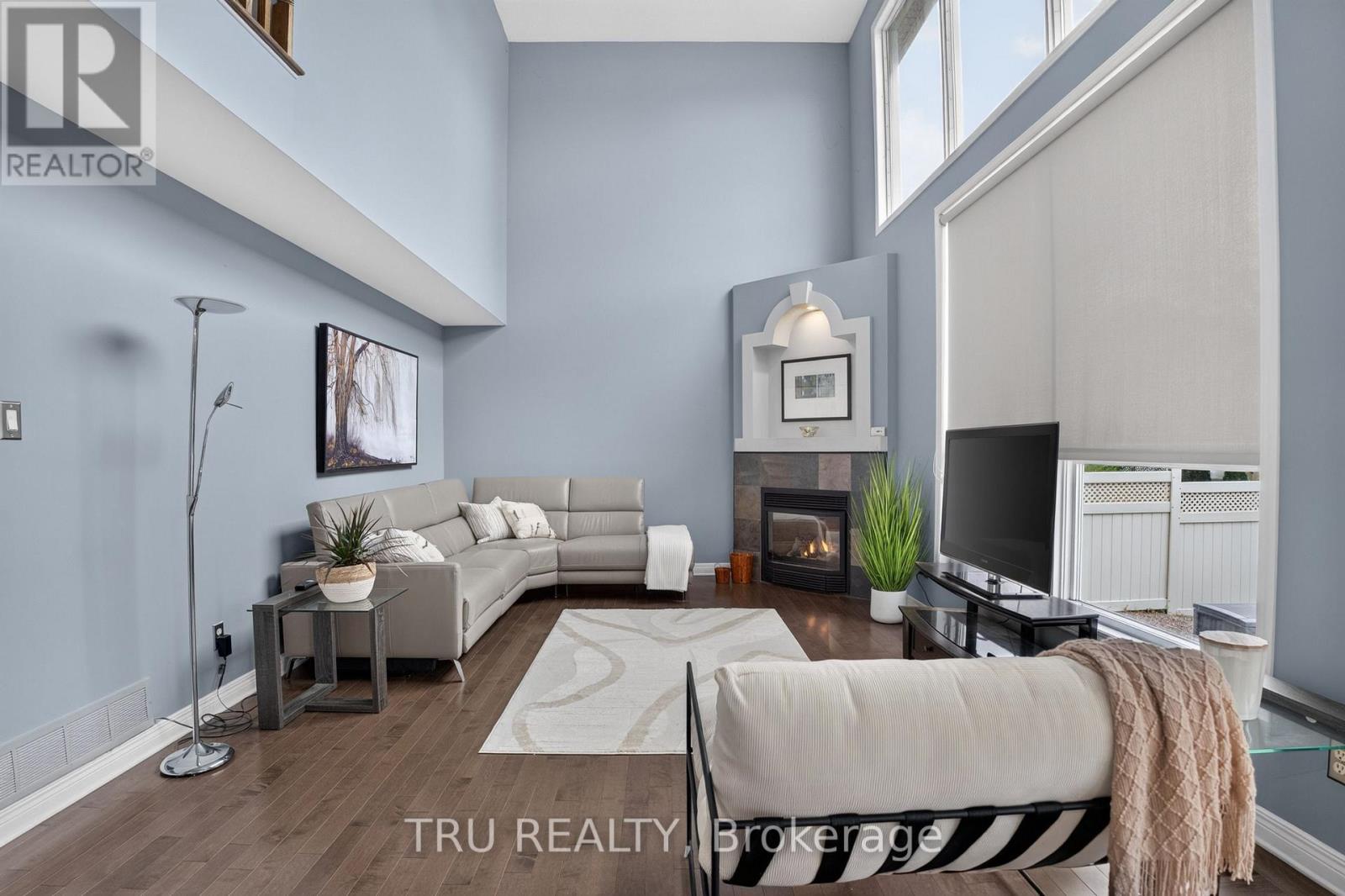 Family Room with Gas Fireplace - 57 Golflinks Drive, Ottawa, ON