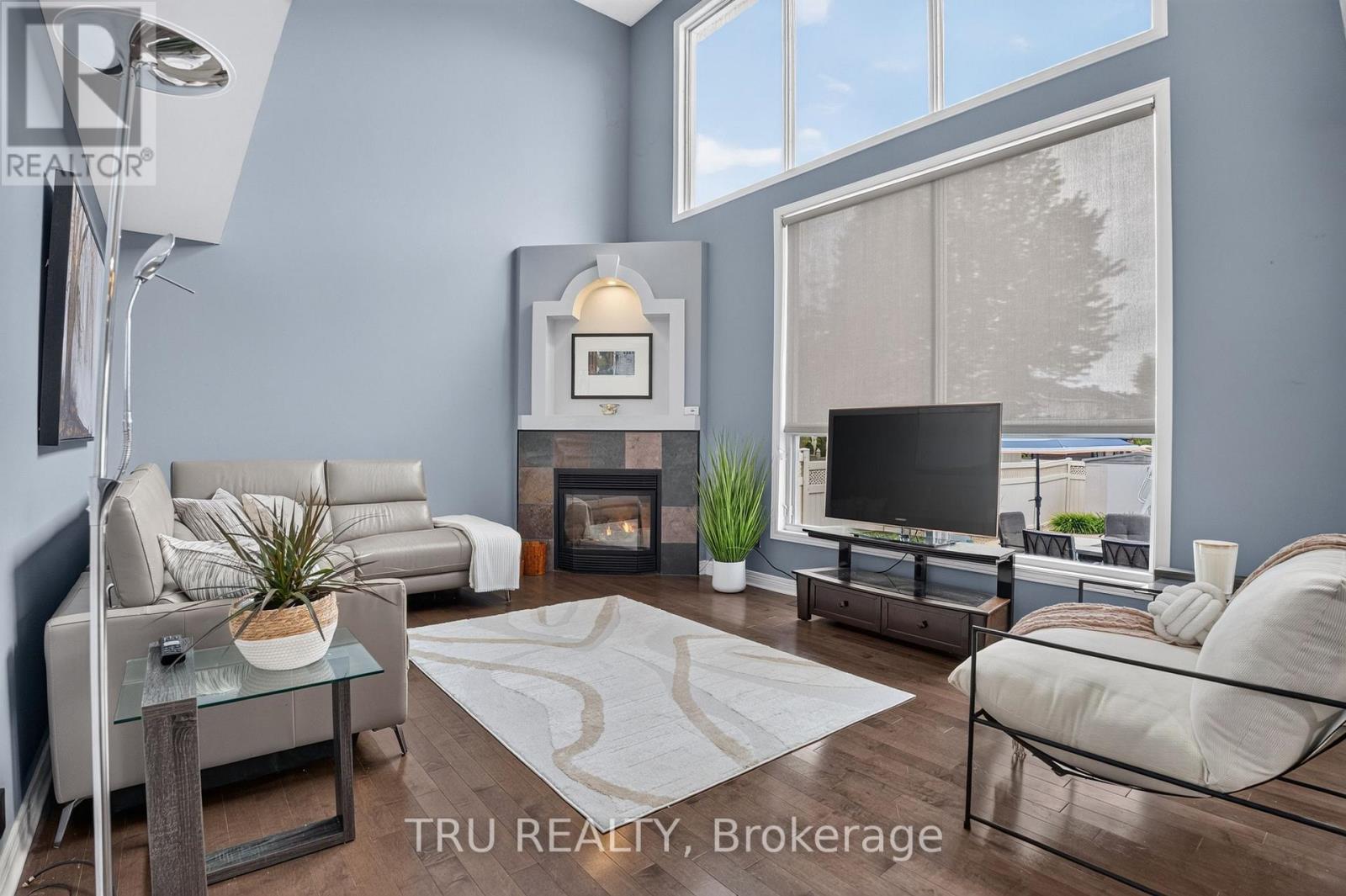 Family Room with Gas Fireplace - 57 Golflinks Drive, Ottawa, ON