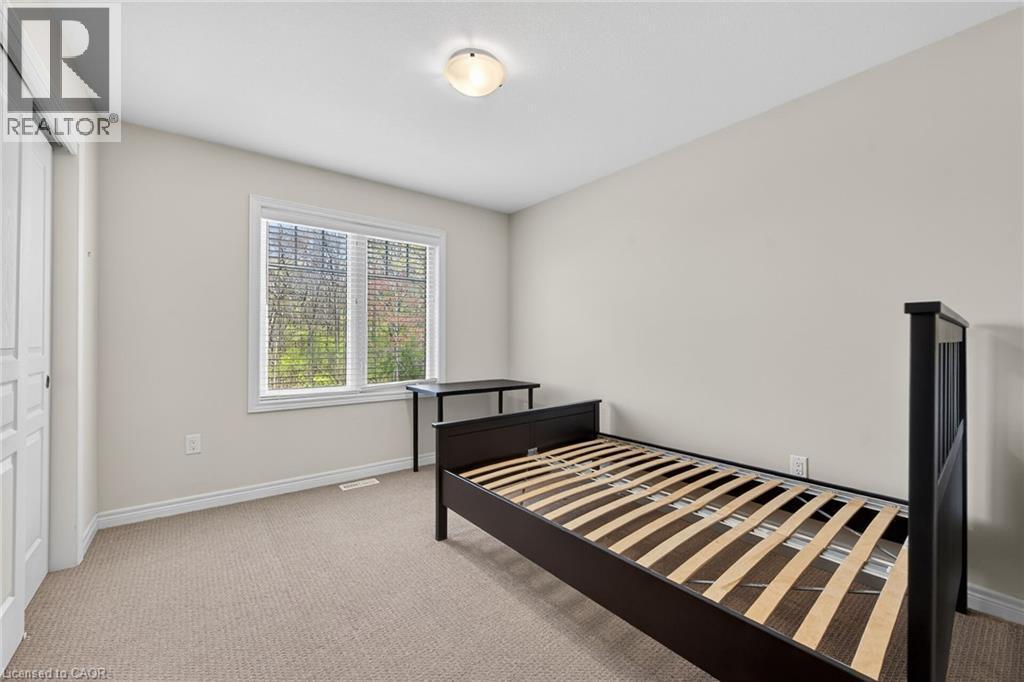 Recessed lighting, light-colored walls, carpeted flooring, and a large window with blinds - 9 Winterberry Boulevard, Thorold, ON