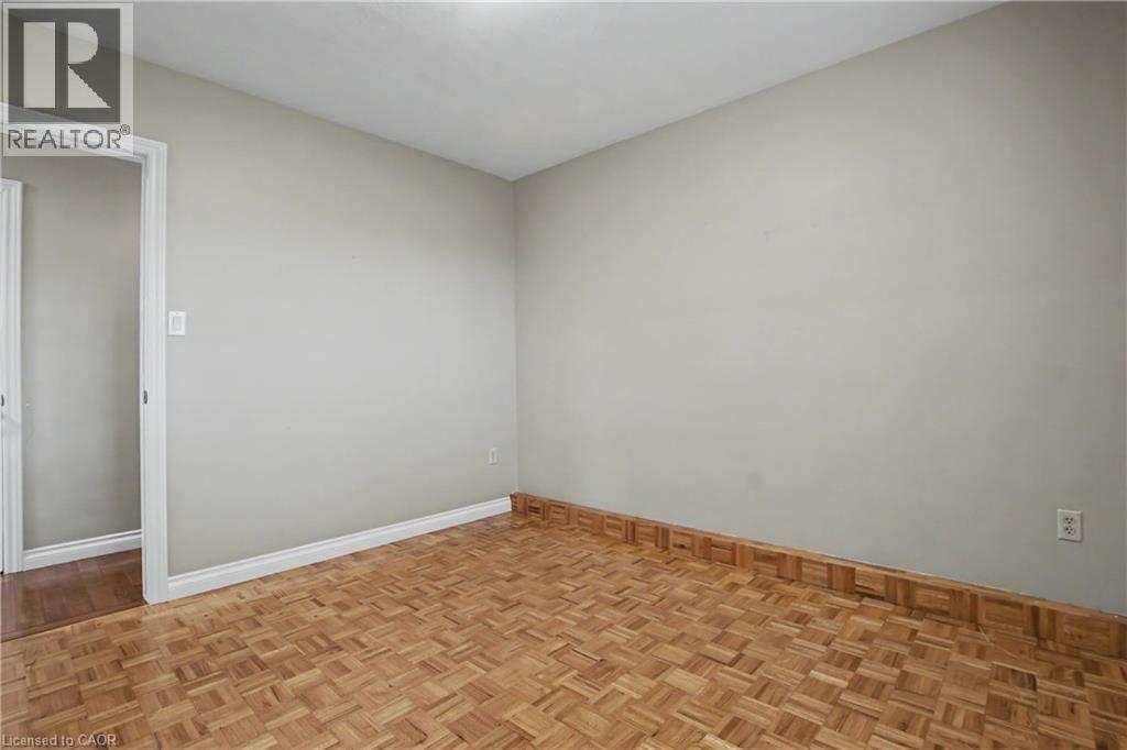 Parquet wood flooring with a decorative wood border - 14 Indian Crescent, Hamilton, ON