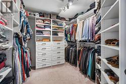 Upgraded, Organized Walk-In Closet in Primary Bdrm - 