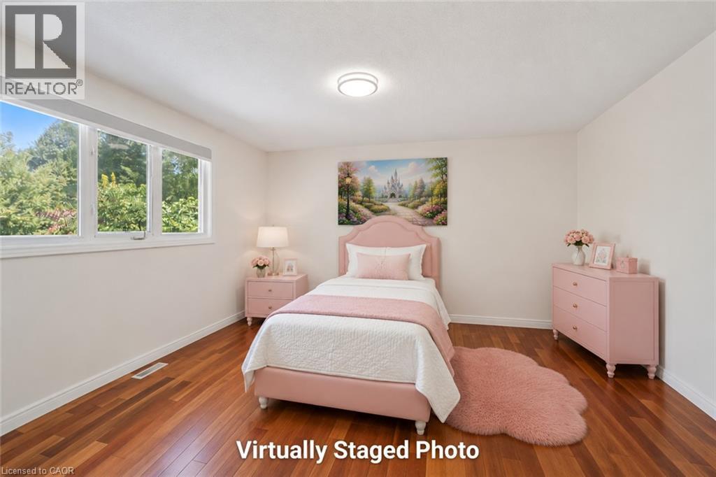 Bright room with wood-finish flooring and white walls - 345 Beechlawn Drive, Waterloo, ON
