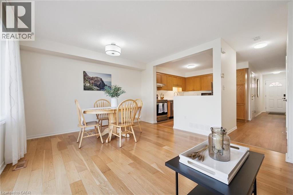 Hardwood flooring throughout, recessed lighting, and a kitchen with wood cabinetry - 151 Clairfields Drive Unit# 3, Guelph, ON