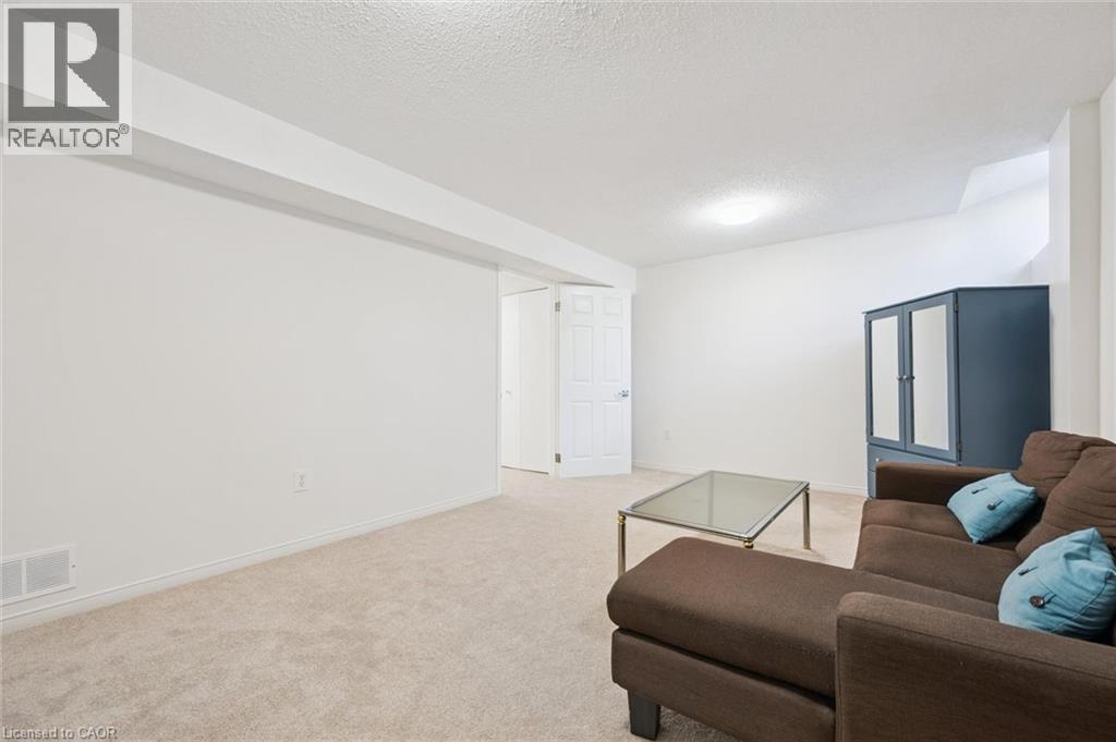 Recessed lighting, light-colored carpeting, white interior doors, and clean white walls - 151 Clairfields Drive Unit# 3, Guelph, ON
