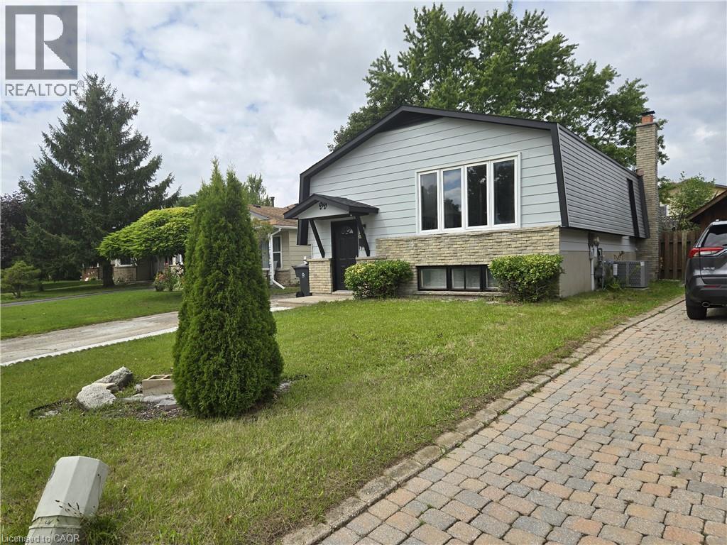 Split-level residence featuring light gray siding, a stone facade, and a dark asphalt roof - 99 Cluthe Crescent, Kitchener, ON