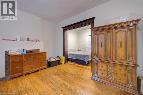 private livingroom for Primary bedroom 1 with private 3 piece ensuite bath.  pocket doors - 24 Hunt Street, Hamilton, ON 