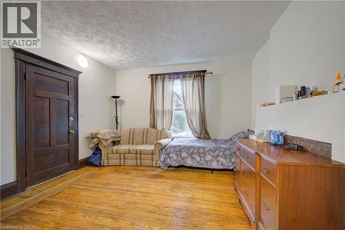 private livingroom with pocket doors to primary bedroom 1 - 24 Hunt Street, Hamilton, ON 