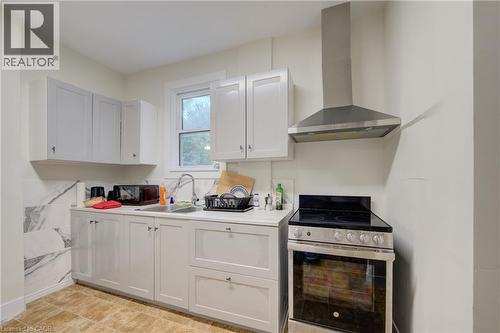 modern kitchen with stainless steel appliances - 24 Hunt Street, Hamilton, ON 