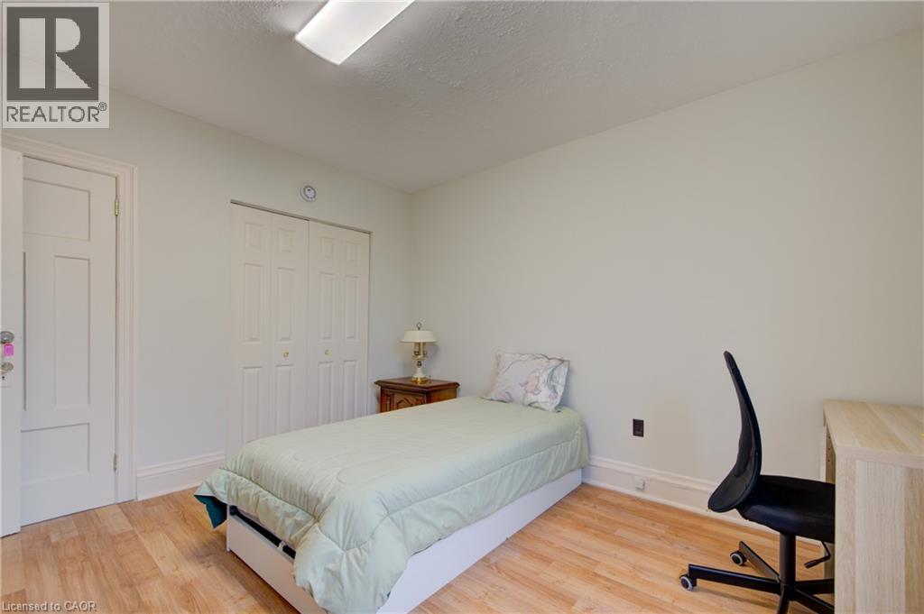 bedroom 2 with private deck - 24 Hunt Street, Hamilton, ON
