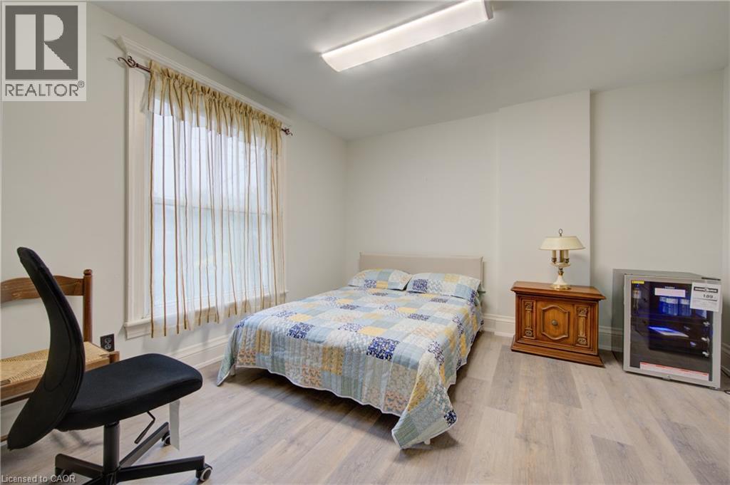 Primary Bedroom 3 with private 3 piece ensuite bath, fridge - 24 Hunt Street, Hamilton, ON