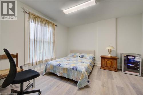 Primary Bedroom 3 with private 3 piece ensuite bath, fridge - 24 Hunt Street, Hamilton, ON 