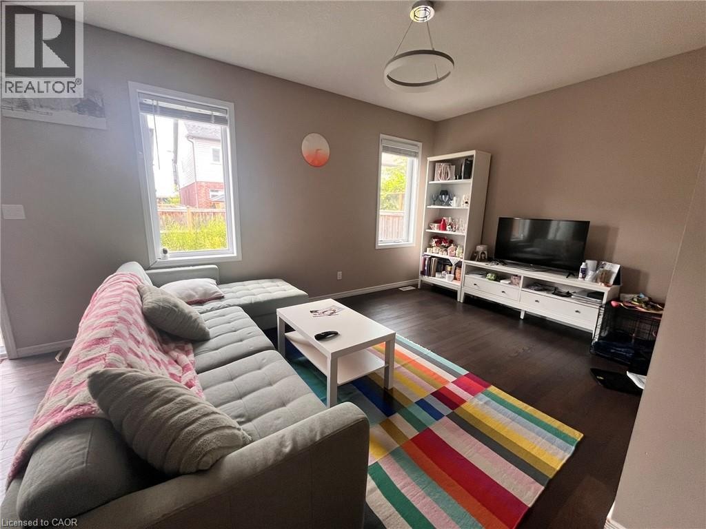 Recessed lighting, wood-finish flooring, and multiple windows - 298 Buttonbush Street, Waterloo, ON