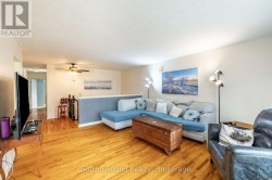Large Living room with hard wood floor - 