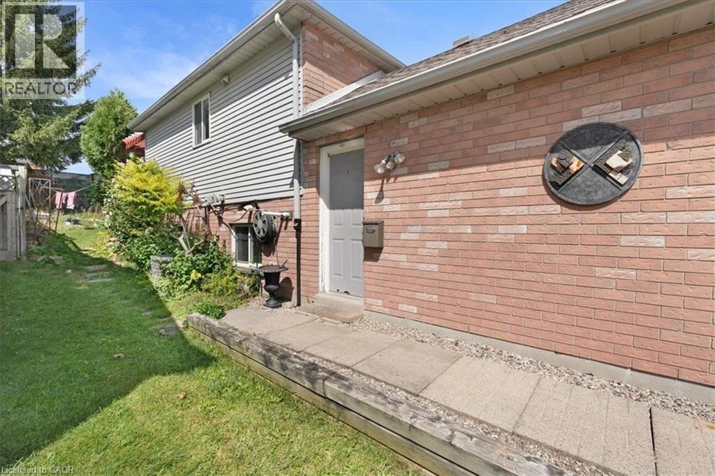 Brick exterior with horizontal siding accents - 150 Bankside Drive, Kitchener, ON