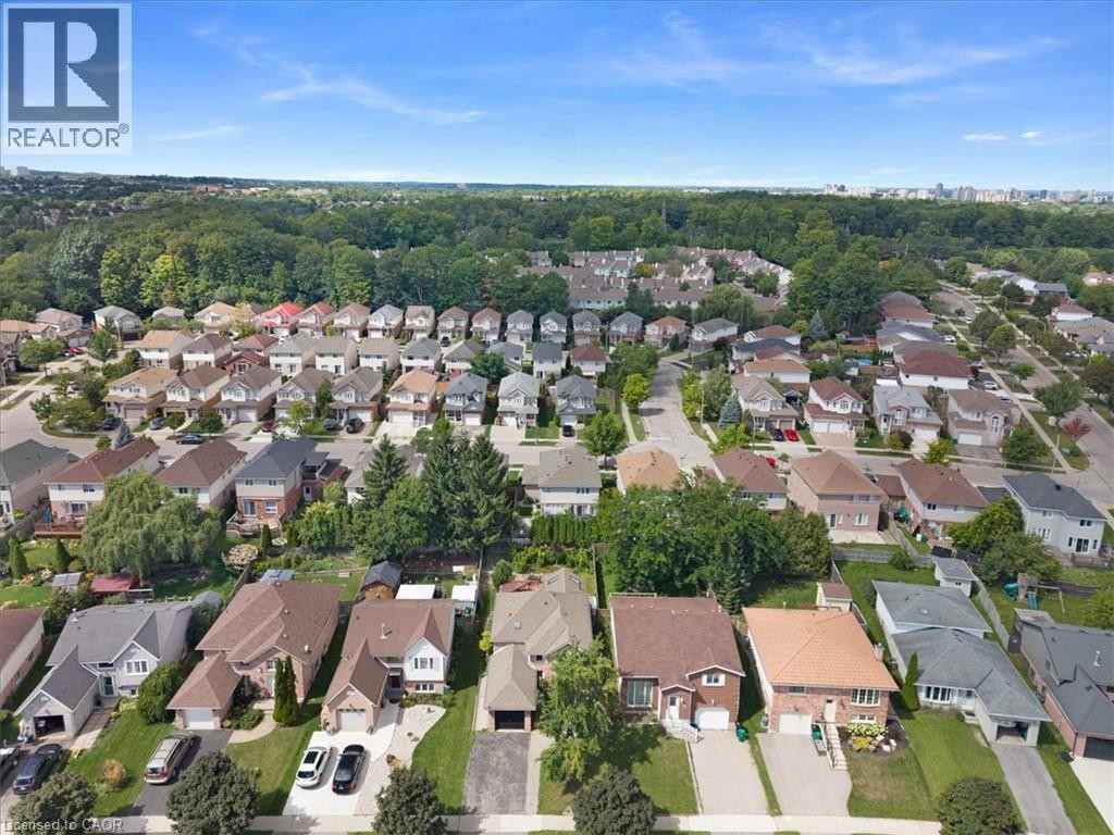 Residential area with a variety of architectural styles, mature trees, and paved streets - 150 Bankside Drive, Kitchener, ON