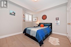 spacious second bedroom at front of the unit - 