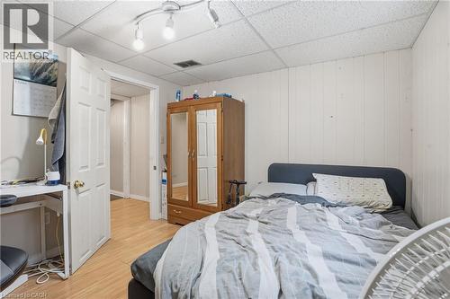 Recessed ceiling panels, track lighting, and wood-finish flooring characterize this room - 139 Dalewood Avenue, Hamilton, ON 