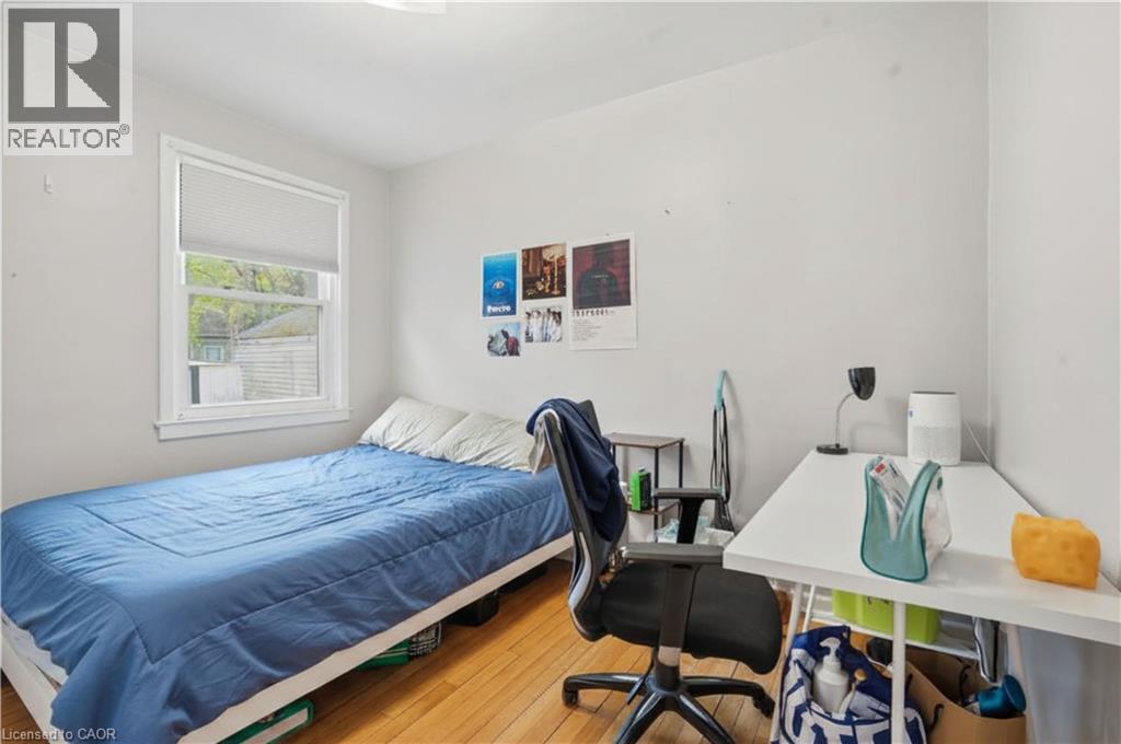 White-painted interior walls with wood-finish flooring - 139 Dalewood Avenue, Hamilton, ON