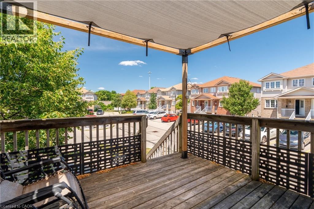 Wood deck with a partial overhead canopy - 50 Howe Drive Unit# 19B, Kitchener, ON
