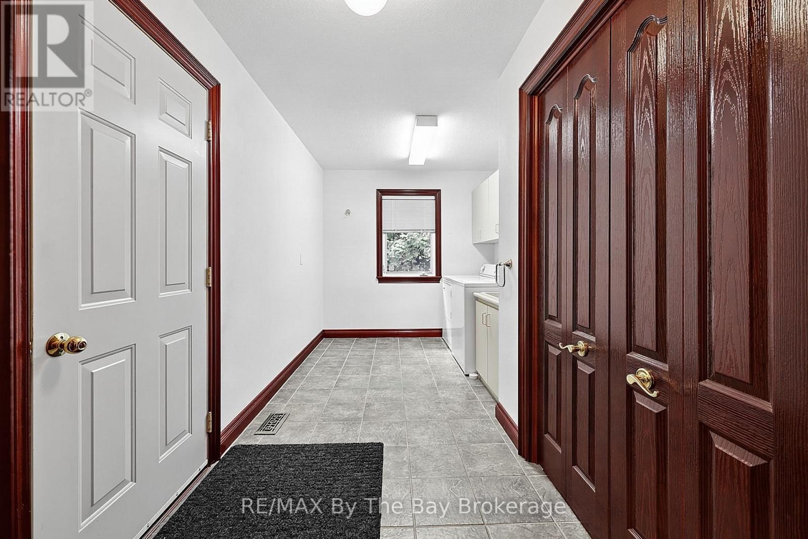 Main Floor Laundry Room with Garage Entry - 90 Goldfinch Crescent, Tiny, ON