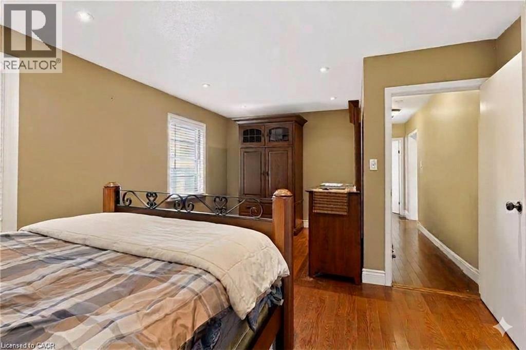 Recessed lighting and wood-finish flooring - 1046 Shepherds Drive, Burlington, ON