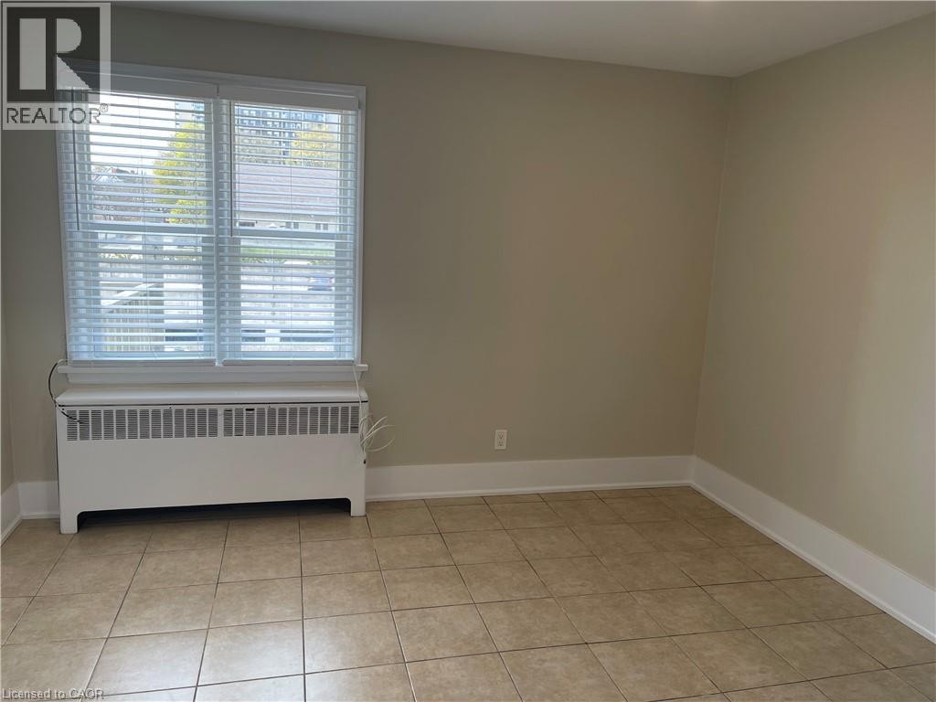 Tile flooring and neutral wall tones - 181 King Street E Unit# 14, Kitchener, ON