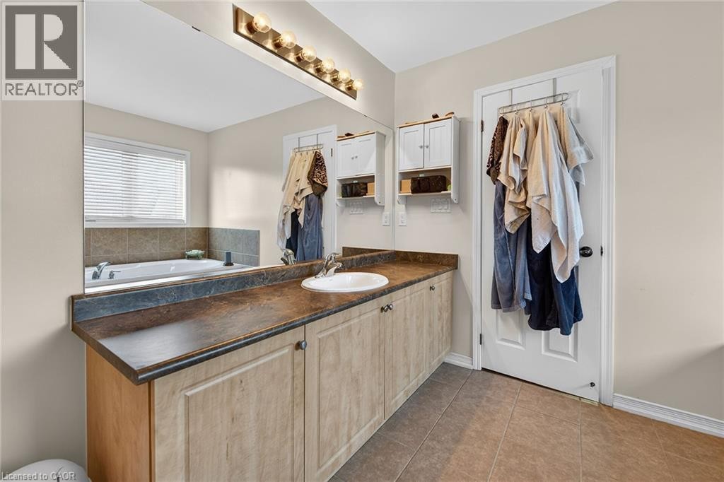 Full bath with vanity and tile patterned flooring - 97 Sirente Drive, Hamilton, ON