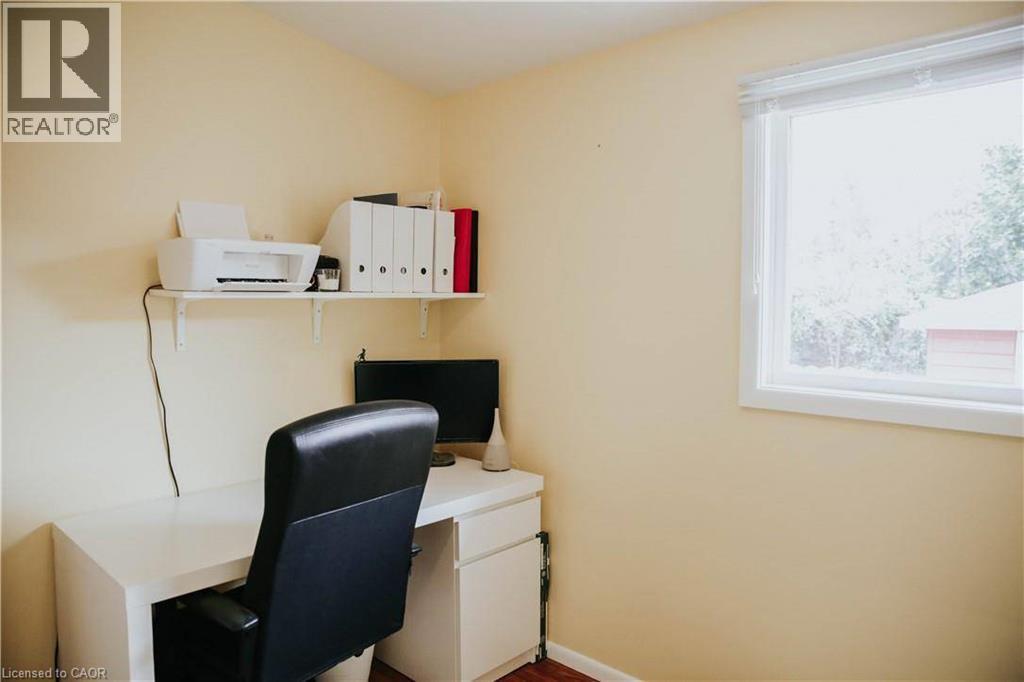 Room featuring a white-framed window, light-colored walls, and wood-finish flooring - 1 Vera Court, Hamilton, ON