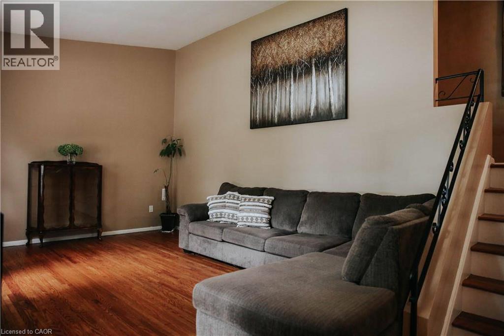Warm-toned walls complement wood flooring - 1 Vera Court, Hamilton, ON