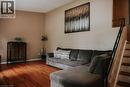 Warm-toned walls complement wood flooring - 1 Vera Court, Hamilton, ON 