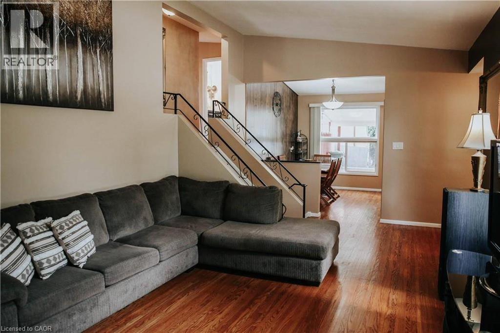 Hardwood-style flooring throughout the main level - 1 Vera Court, Hamilton, ON