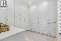 Integrated custom cabinetry system featuring extensive storage, multiple drawer configurations, and sleek hardware - 