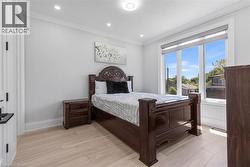 Light wood-finish flooring complements the neutral wall color in this room - 