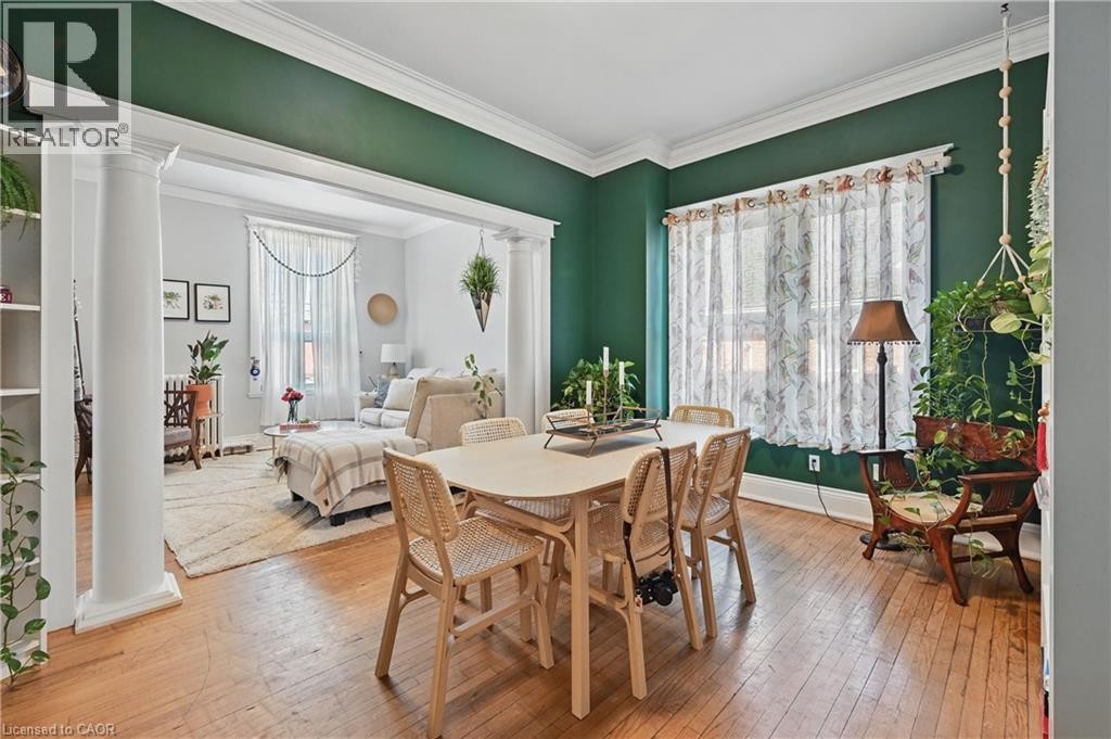 Hardwood flooring throughout, with decorative wall molding - 55 Barton Street W, Hamilton, ON
