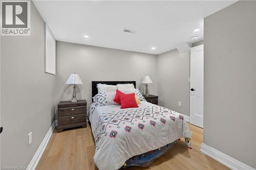 Recessed ceiling lighting, wood-finish flooring, white trim, and a built-in window - 135 Nugent Drive, Hamilton, ON 