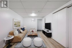 Virtually staged basement living room - 