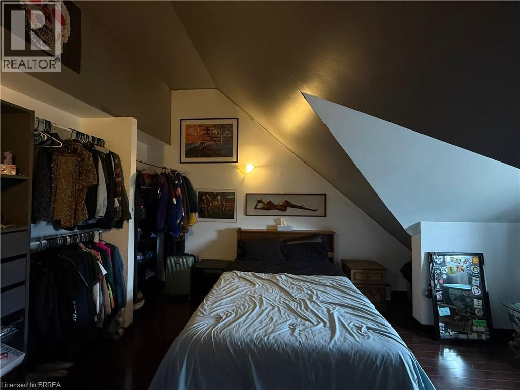 Wood-finish flooring with an angled ceiling design - 12 Bridgeport Road E Unit# 18, Waterloo, ON