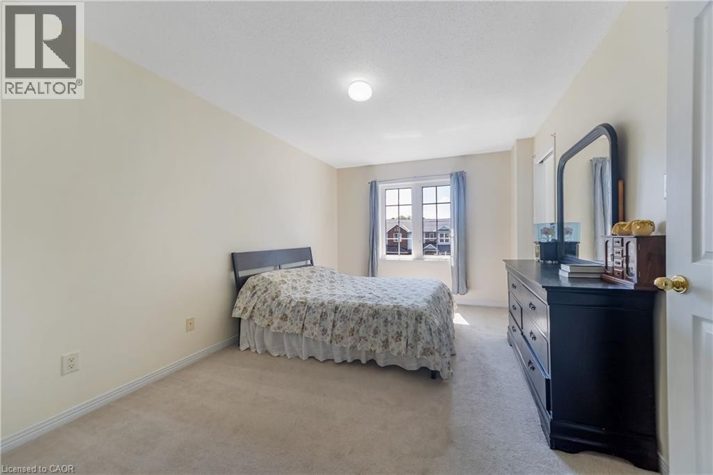 Neutral-toned carpeting paired with light-colored walls - 82 Milner Downs Crescent, Ottawa, ON