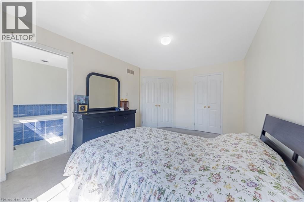 Recessed lighting, wall-to-wall carpeting, and white paneled closet doors - 82 Milner Downs Crescent, Ottawa, ON