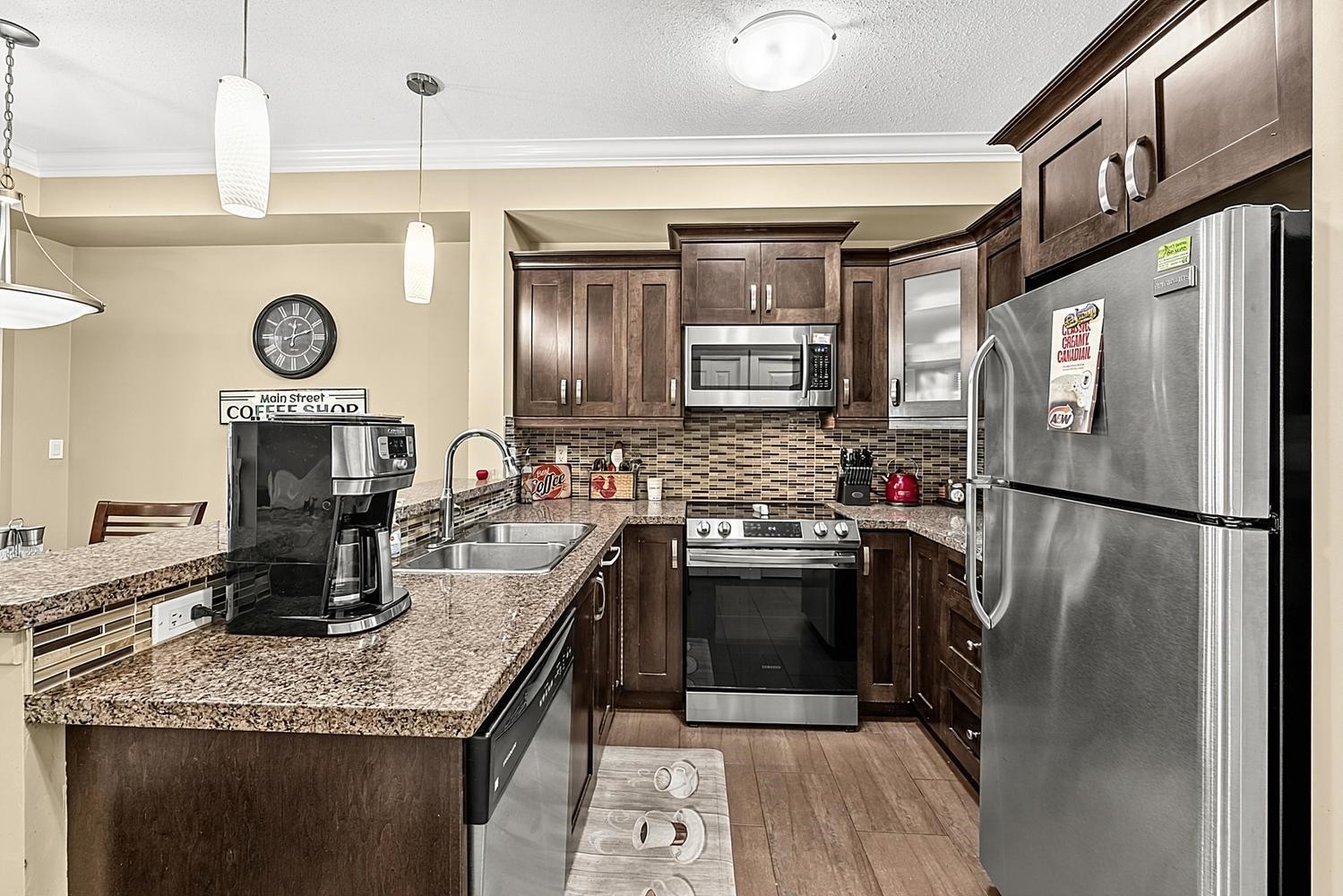 411-13897 Fraser Highway, Surrey, BC - Indoor Photo Showing Kitchen With Stainless Steel Kitchen With Double Sink With Upgraded Kitchen