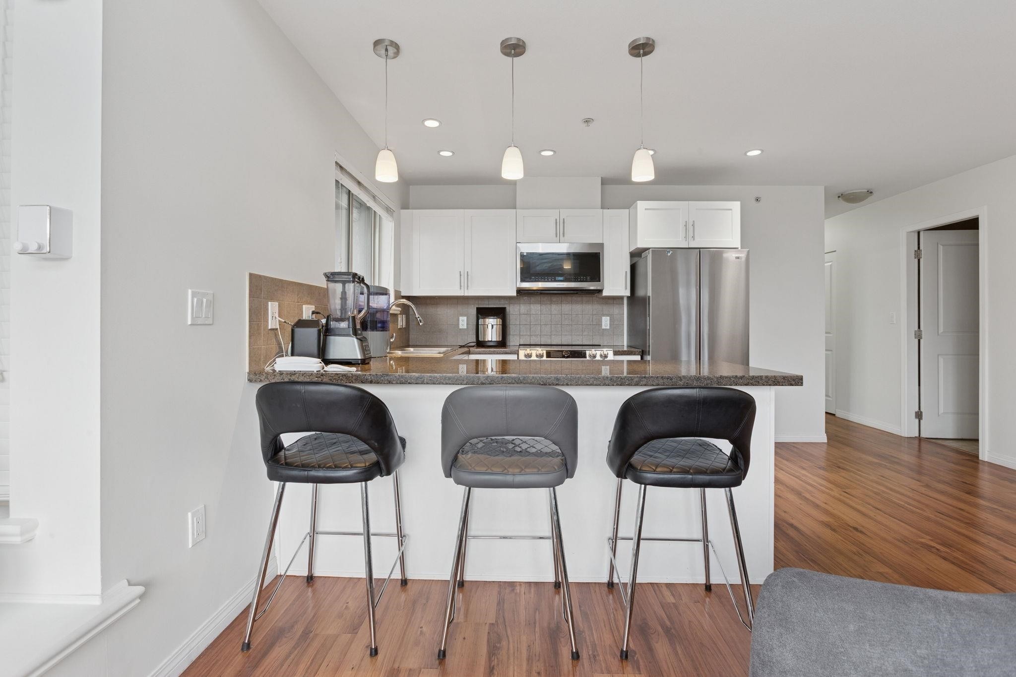 301-5000 Imperial Street, Burnaby, BC - Indoor Photo Showing Kitchen With Stainless Steel Kitchen With Upgraded Kitchen