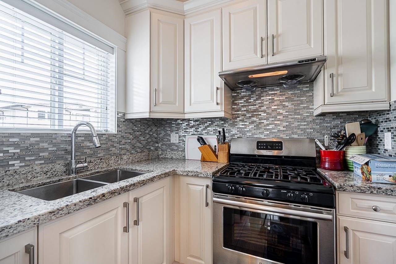 1606 29Th Avenue E, Vancouver, BC - Indoor Photo Showing Kitchen With Double Sink With Upgraded Kitchen