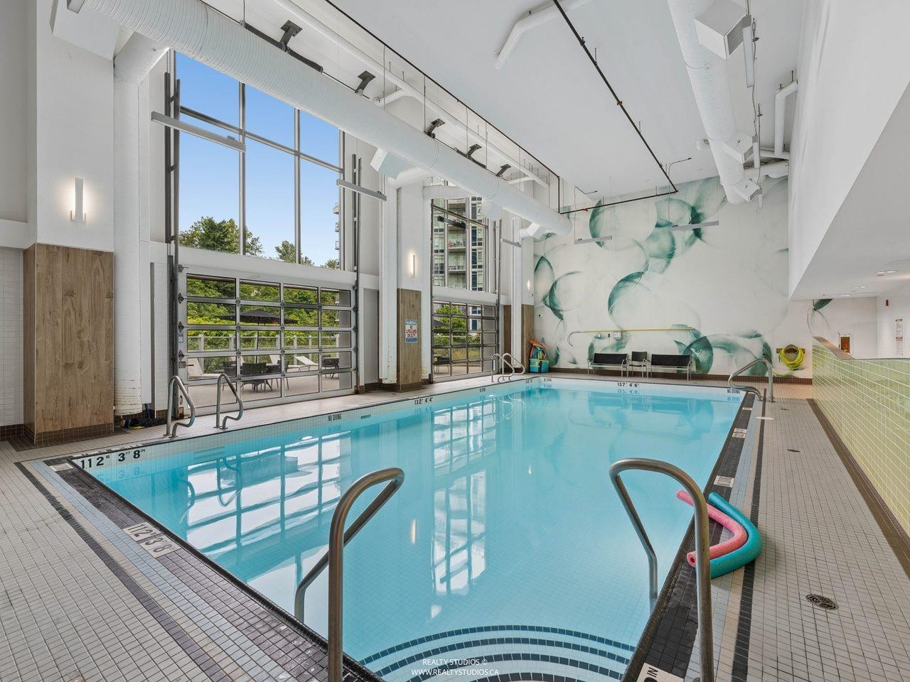 205-8538 River District Crossing, Vancouver, BC - Indoor Photo Showing Other Room With In Ground Pool